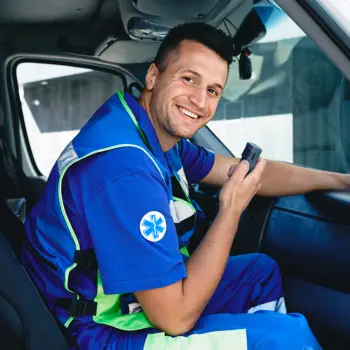 man smiling inside vehicle