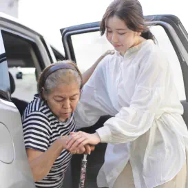 woman assisting senior