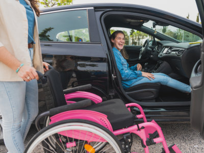 woman inside car ready to transfer to wheelchair