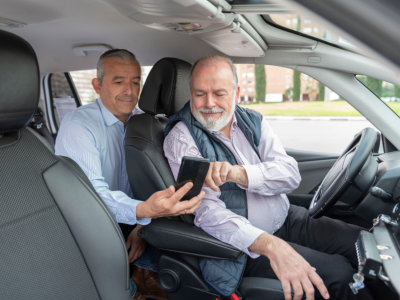 driver assisting senior to destination