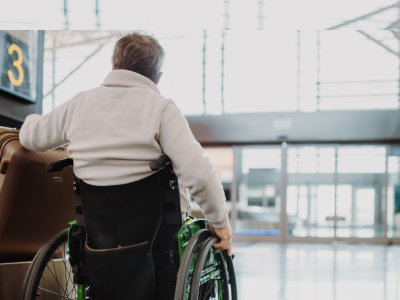 man on wheelchair at airport