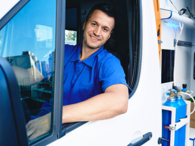 Smiling Medical Professional in Ambulance