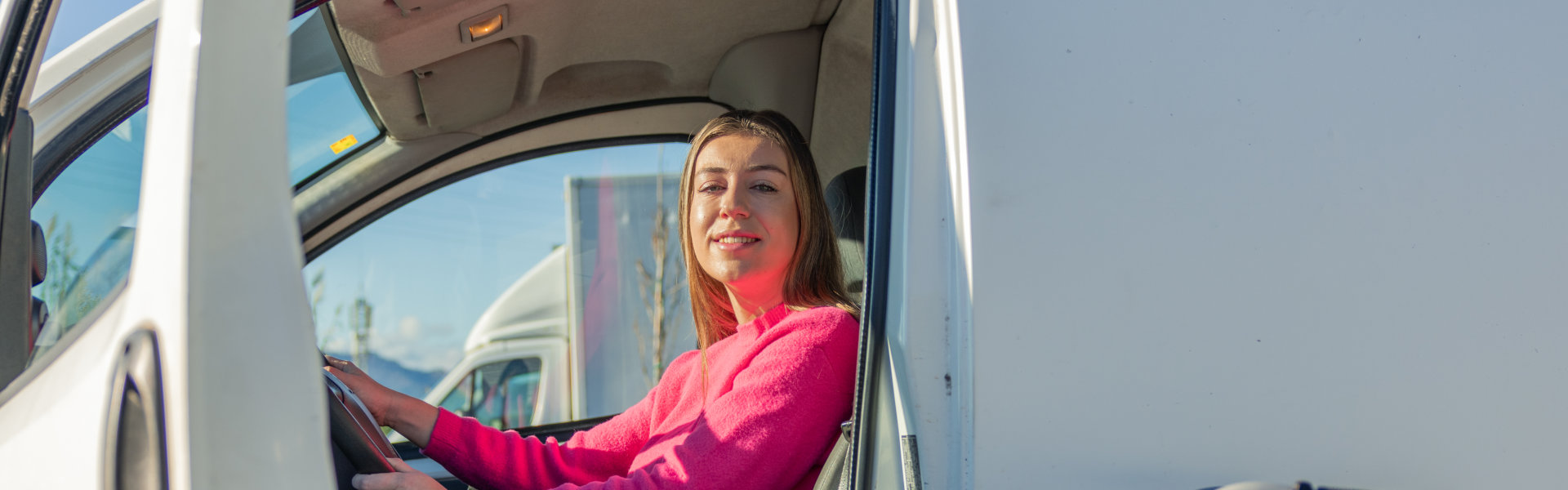 woman smiling inside van
