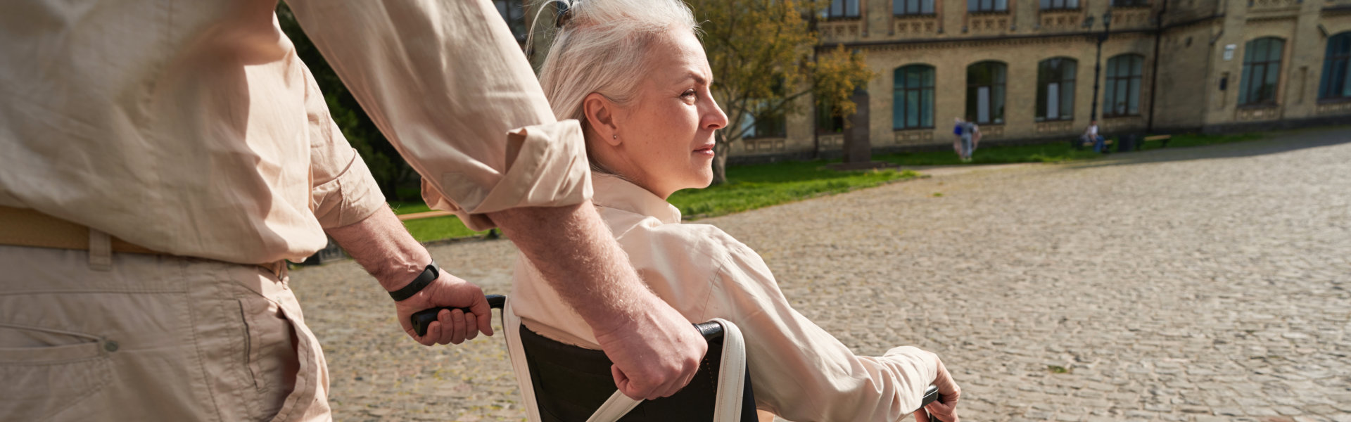 woman in wheelchair assisted