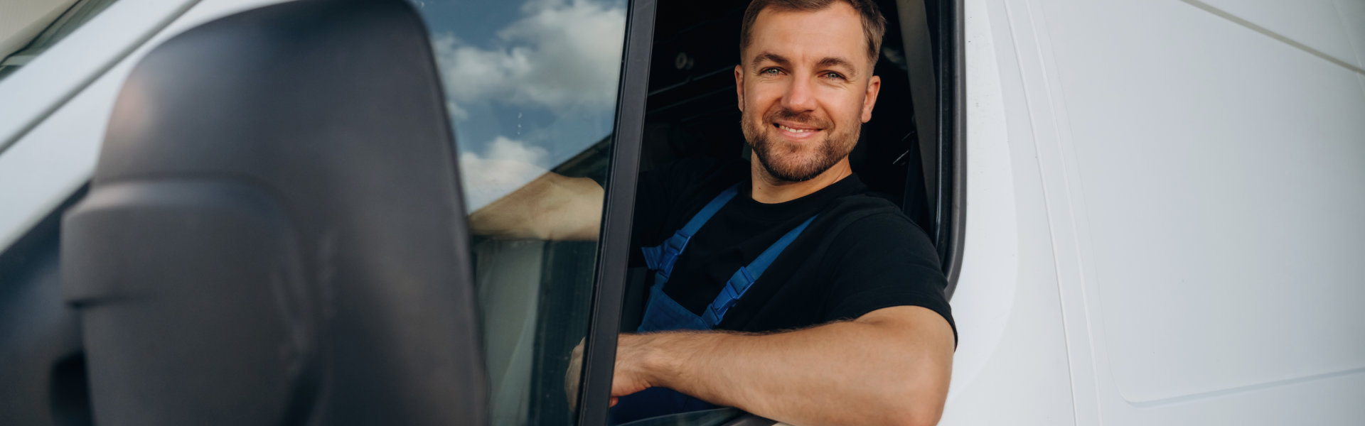 man inside the vehicle smiling